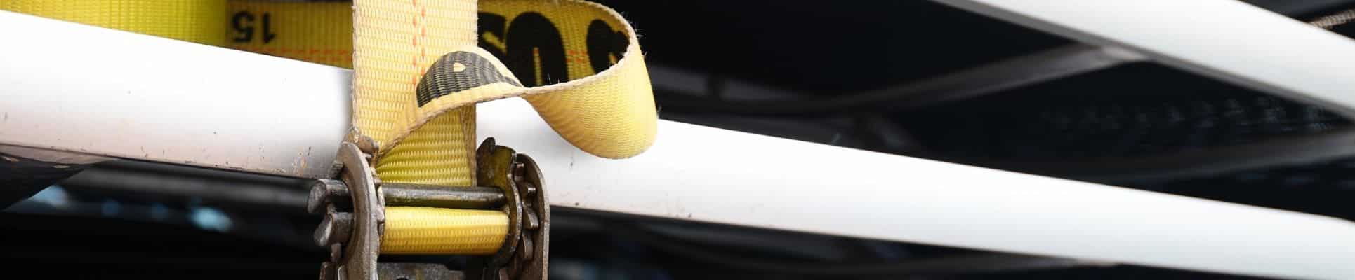 Cargo Load Bars vs. Ratchet Straps: What’s the Difference?